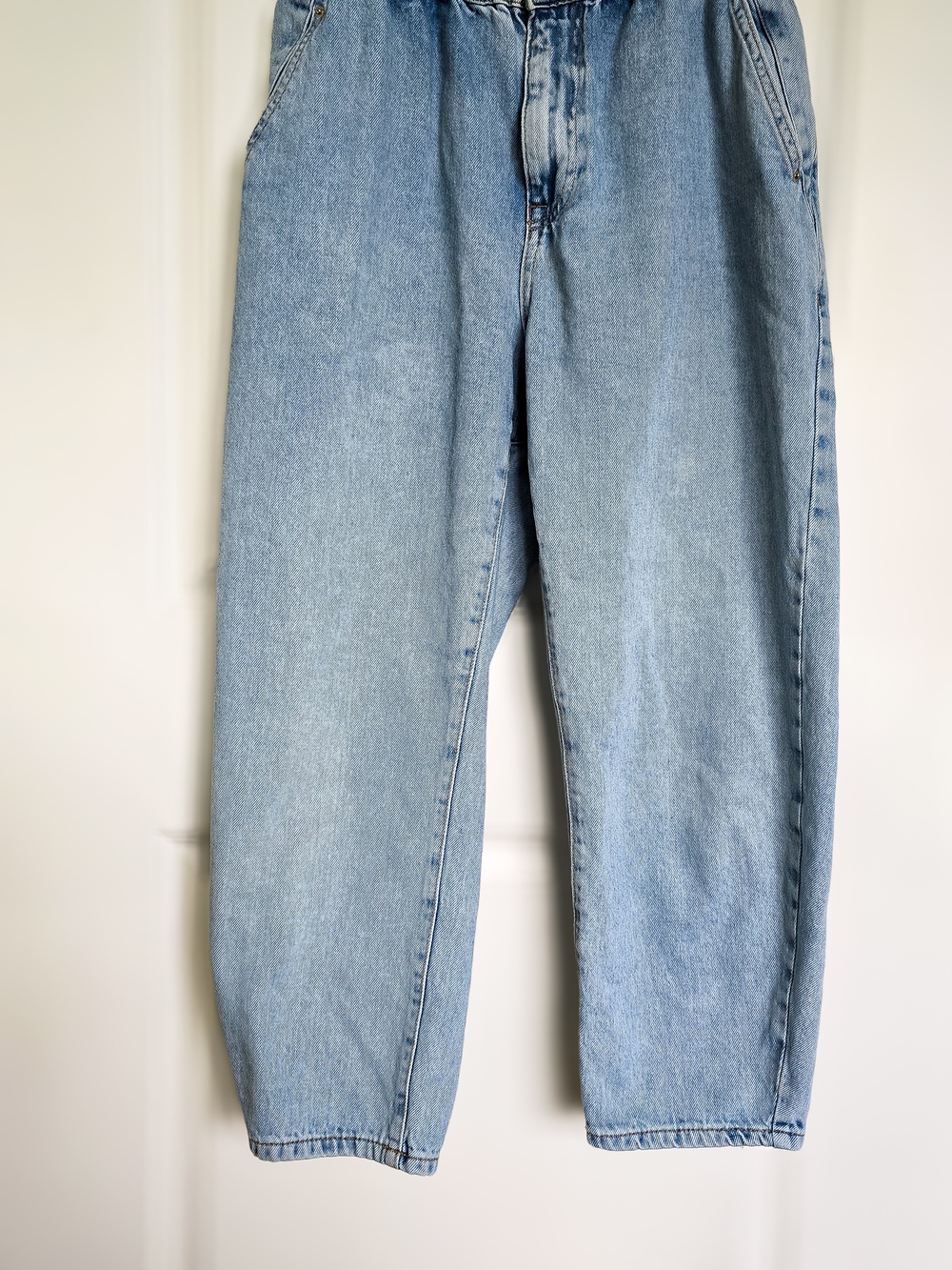 Zara light wash paperbag jeans with a relaxed tapered fit.